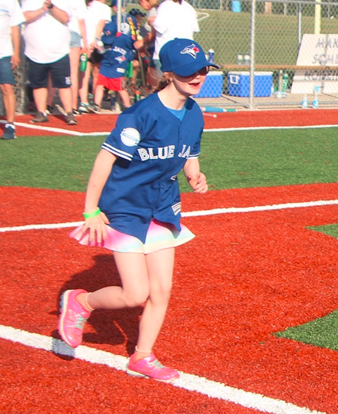 Challenger Baseball participant runsthe bases. 